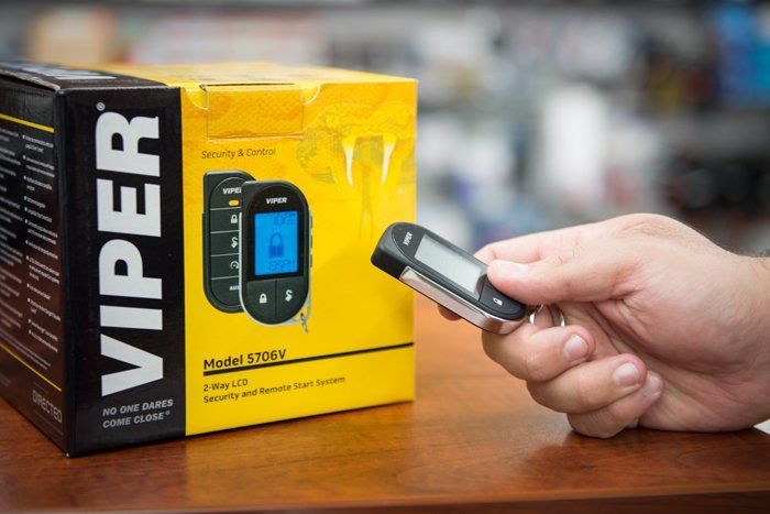 Car Alarm Installation San Antonio - Hand holding a Viper remote starter for a vehicle security system